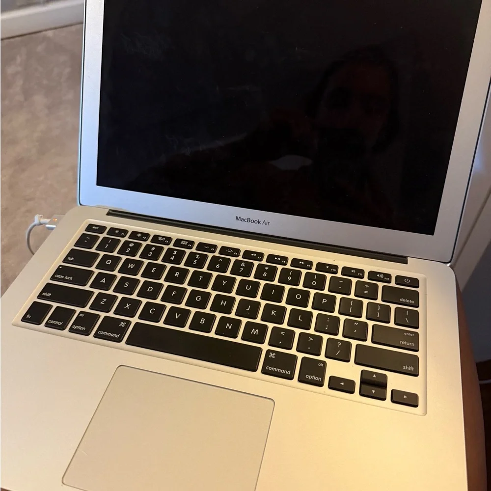 Apple Silver MacBook Laptop with Minimalist Design and Backlit Keyboard